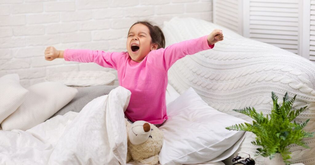 Child waking up feeling refreshed after sleeping on a Naturelle Mattress - this is why children need a quality mattress