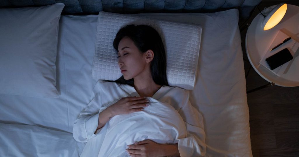 Woman sleeping on her back.