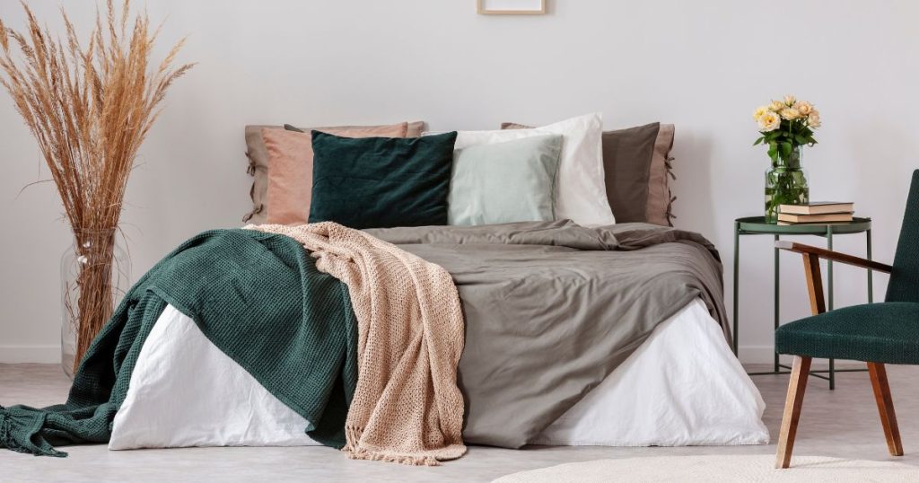 Bed with an extra large duvet inner that drapes over the entire surface of the bed set.