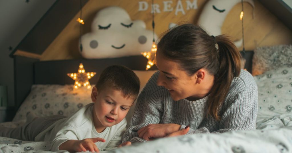 Mom and son chatting before bedtime as a method of preventing sleep disorders in children