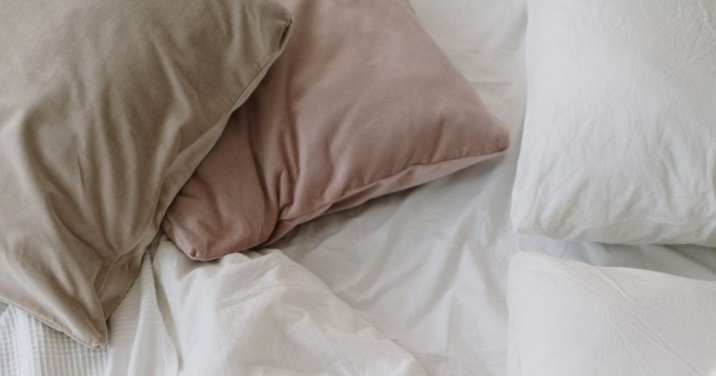 Pillows scattered across a bed