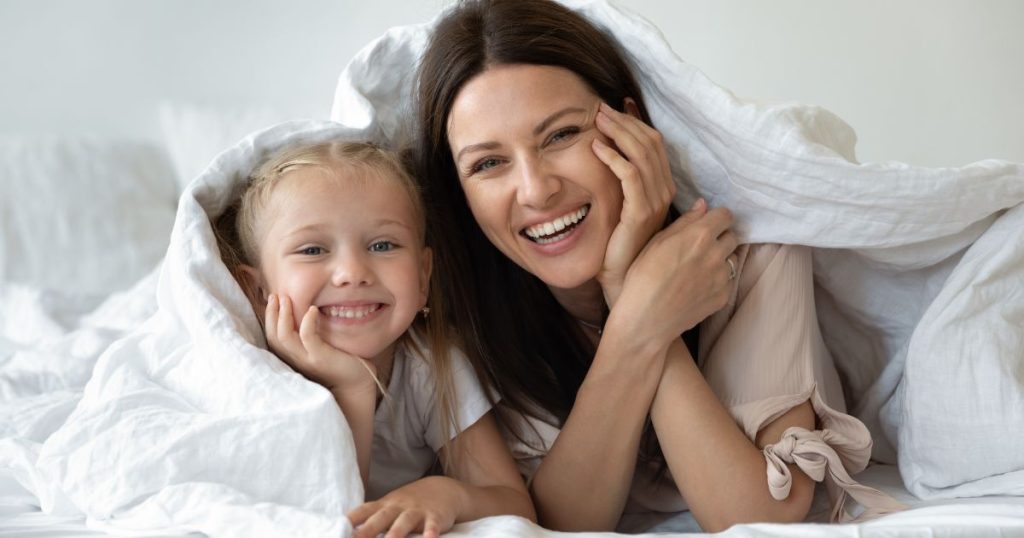 Mom and daugter under a pure wool duvet